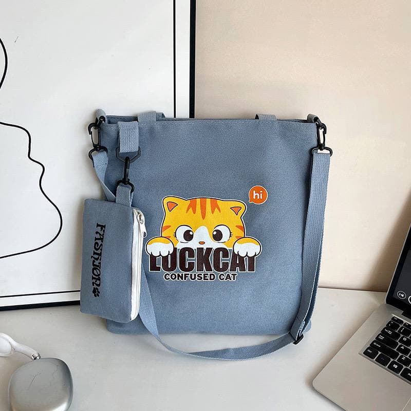 purseC faded blue tote bag